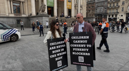 Police arrested Lois McLatchie Miller, a senior legal communications officer with ADF International (left) and Canadian child protection advocate Chris Elston, also known as Billboard Chris, for peacefully displaying a sign that read: “Children are never born in the wrong body” in In Brussels, Belgium, on June 5, 2025.