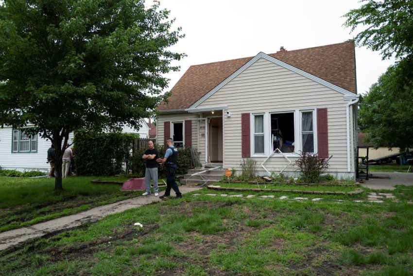 Vance Boelter's roommate, who declined to give his name, speaks with a Minneapolis police officer outside his home on June 14, 2025 in Minneapolis, Minnesota. Boelter a suspect in the shooting of two Democratic-Farmer-Labor lawmakers. DFL State Rep. Melissa Hortman and her husband, Mark Hortman, were shot and killed this morning. DFL State Sen. John Hoffman and his wife were also shot and hospitalized in a separate incident. Minnesota Gov. Tim Walz said during a press conference that the shooting