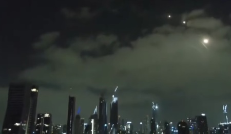 Iranian missiles fly over the skyline of Tel Aviv, Israel, on June 16, 2025.