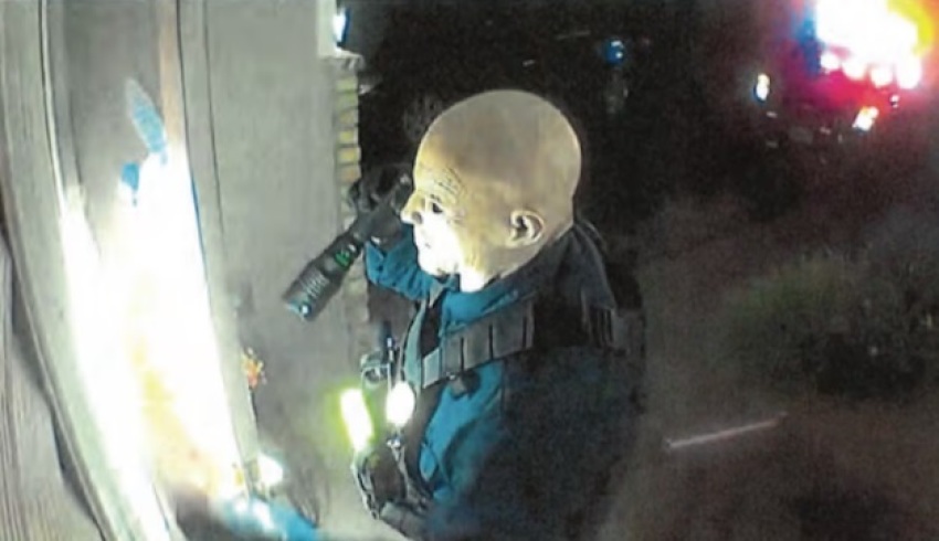 Authorities say this screenshot shows a masked Vance Luther Boelter knocking on the door of one of his victims' homes. 