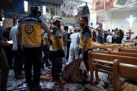 Emergency responders work at the site of a blast at the Mar Elias Church on June 22, 2025, in Damascus, Syria. A suspected suicide bombing has killed at least 20 people and injured 52 others who were attending a service at the Mar Elias Church in Damascus, according to Syria's Ministry of Health.