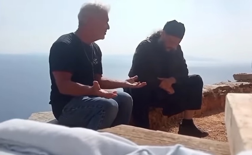 Actor and filmmaker Mel Gibson (left) with an unidentified monk at Mount Athos monastery in Greece in June 2025.