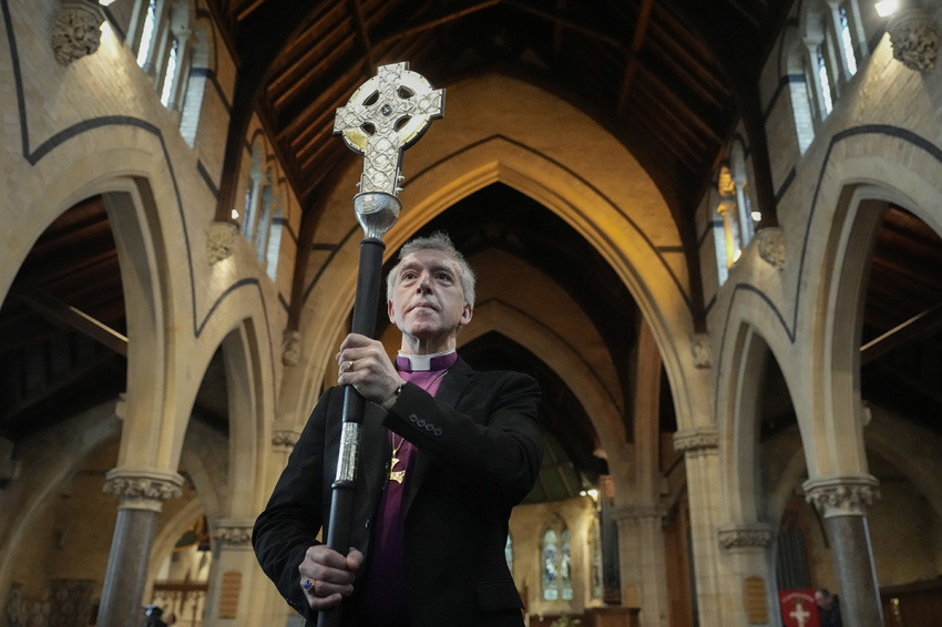 Archbishop of Wales Andrew John poses with the Cross of Wales ahead of the blessing of the cross at Holy Trinity Church, Llandudno on April 19, 2023, in Llandudno, Wales. The Cross of Wales, is a new processional cross presented by His Majesty King Charles III as a centenary gift to the Church in Wales and will lead the Coronation procession at Westminster Abbey on 6 May. Words from the last sermon of St. David are chased on the back of the Cross in Welsh: “Byddwch lawen. Cadwch y ffydd. Gwnewch y Pethau Bychain," which translates as: “Be joyful. Keep the faith. Do the little things.” The cross was designed and made by master silversmith Michael Lloyd.