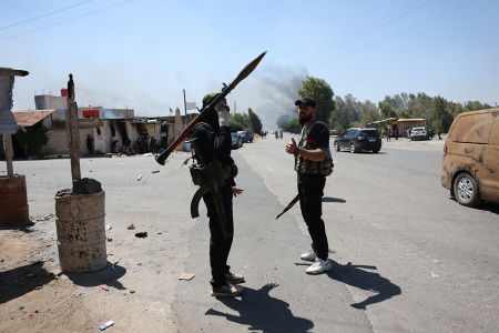 A Bedouin fighter is seen on the street on July 18, 2025, in Sweida, Syria. Fighting has flared up again between the Bedouin tribe and Druze sect in the southern Syrian province of Suwayda, as another ceasefire has collapsed a day after Syrian troops pulled out of the area.