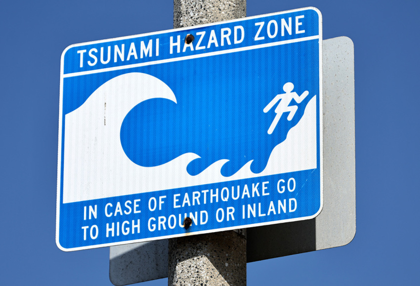 A tsunami hazard zone sign is posted near Santa Monica beach with a tsunami advisory in effect in other parts of California on July 30, 2025, in Santa Monica, California. Authorities are warning people to stay away from some beaches after a massive 8.8 earthquake on the east coast of Russia triggered a tsunami warning for Hawaii and the west coast of the United States. No major damage has been reported. 