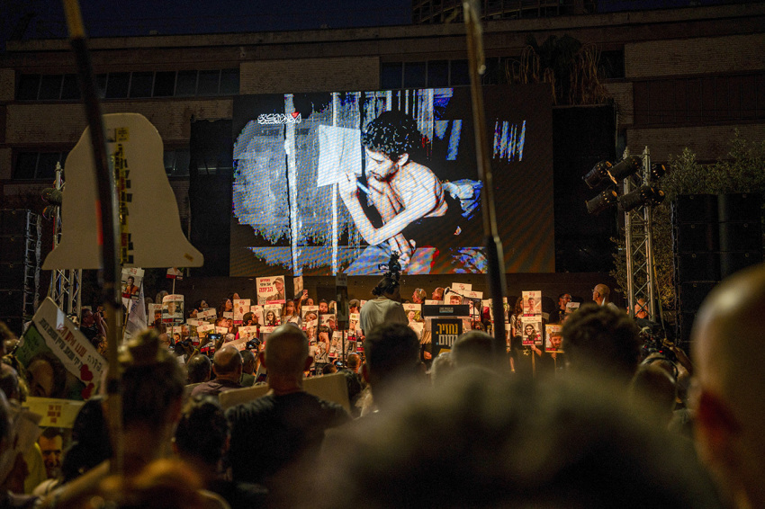 Families of hostages gather in Tel Aviv, Israel, on Aug. 2, 2025, marking day 666 since the Oct. 7, 2023, attacks. During the rally, attendees watch a newly released video by Hamas showing Evyatar David, an Israeli hostage, in a severely malnourished condition. The footage sparks emotional reactions among the crowd, deepening public outrage and intensifying calls for a ceasefire-hostage deal. Relatives hold photos of missing loved ones and wear yellow ribbons, demanding urgent government action to secure their release. The protest forms part of a broader movement that has maintained pressure on Israeli leadership as the hostage crisis persists. Demonstrators voice frustration over stalled negotiations and the humanitarian toll of prolonged captivity. The emotional impact of the video underscores the urgency of resolution, as hostage families continue to seek answers, accountability, and the safe return of those still held in Gaza. 