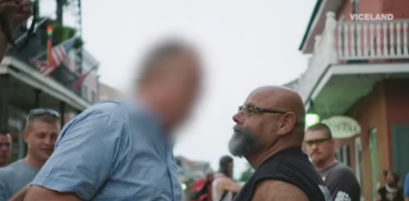 A screenshot from a 2018 video showing late street preacher Ruben Israel (right) and a man believed to be Arlington Mayor Jim Ross.