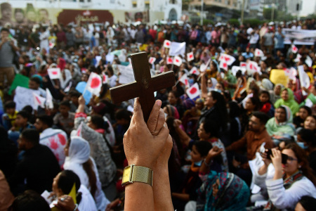 Christians hold the holy cross during a protest in Karachi on Aug.19, 2023, to condemn the attacks on churches in Pakistan. More than 80 Christian homes and 19 churches in Pakistan were vandalized when a Muslim mob rampaged through the streets over alleged blasphemy on Aug. 16, a top police official said on Aug.18.