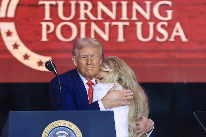 Erika Kirk joins U.S. President Donald Trump onstage during the memorial service for political activist Charlie Kirk at State Farm Stadium on Sept. 21, 2025, in Glendale, Arizona. Kirk, the CEO and co-founder of Turning Point USA, was shot and killed on Sept. 10 while speaking at an event during his "American Comeback Tour" at Utah Valley University. 