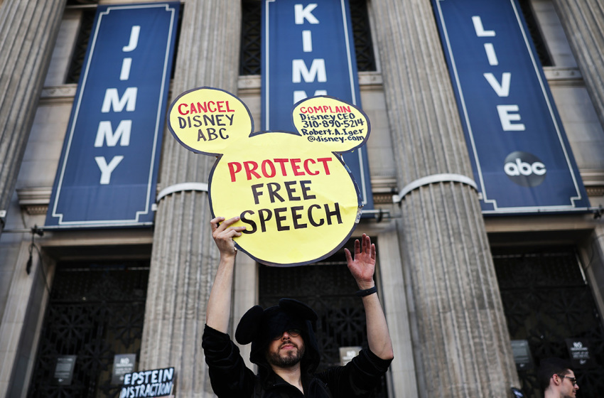 A demonstrator waves a
