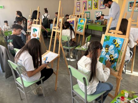 Students work on paintings at the Community and Family nonprofit therapy center in Metsamor, Armenia, on Sept. 25, 2025.
