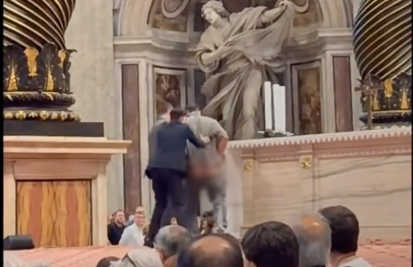 A man is apprehended for urinating at St. Peter's Basilica in the Vatican on Oct. 10, 2025.