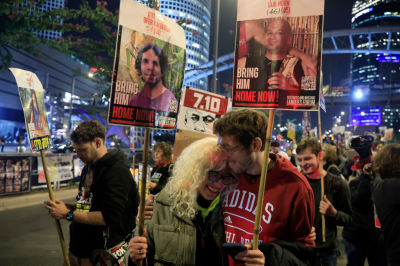 People react to the reports of a possible Gaza cease fire and hostage release deal being reached during a rally calling for the return of hostages held in the Gaza Strip on January 15, 2025 in Tel Aviv, Israel. A ceasefire deal between Israel and Hamas was announced tonight that would entail the release of Israeli hostages held in Gaza, according to officials from Hamas, the United States, and other parties.