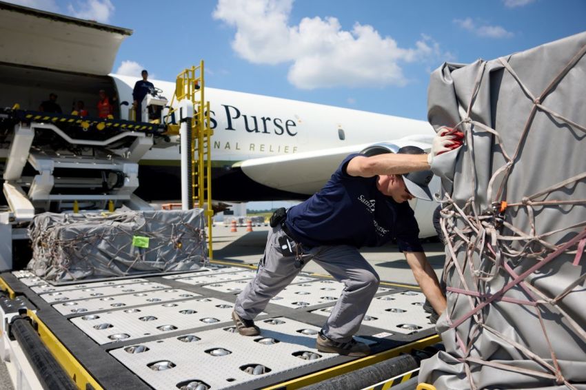 A worker with Samaritan's Purse unloads relief supplies to aid the people of Gaza.