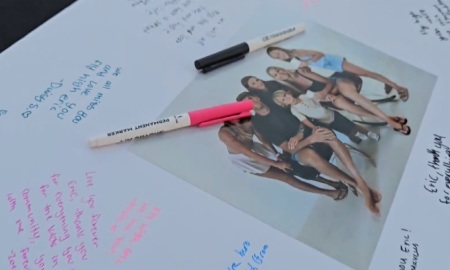 Friends and family signed a poster board following the death of Pastor Eric John Williams on Oct. 20, 2025, in Huntington Beach, California.