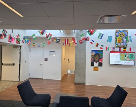 The flags of various countries are displayed inside a building at the Catholic University of America.