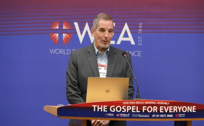 Brad Smith, director of Alliance Engagement for the World Evangelical Alliance, presents participant figures and organizational updates during a press briefing at the WEA General Assembly in Seoul, South Korea, on Oct. 28, 2025. 