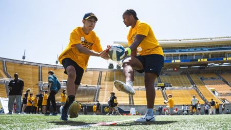 Participants in the E-Football community program play together. The program enables people with and without special needs to play sports with one another.