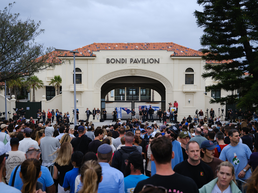 Members of the public lay flowers at a memorial at Bondi Pavilion in the wake of a mass shooting at Bondi Beach yesterday, on Dec. 15, 2025, in Sydney, Australia. Police say at least 16 people, including one suspected gunman, were killed and more than 40 others injured when two attackers opened fire near a Hanukkah celebration at the world-famous Bondi Beach, in what authorities have declared a terrorist incident. 