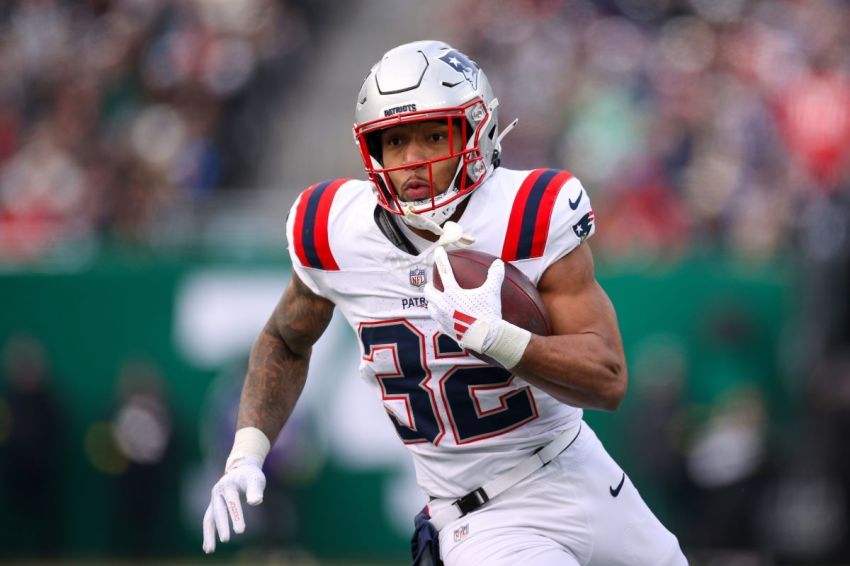 TreVeyon Henderson of the New England Patriots runs with the ball against the New York Jets during the first quarter at MetLife Stadium on Dec. 28, 2025, in East Rutherford, New Jersey.