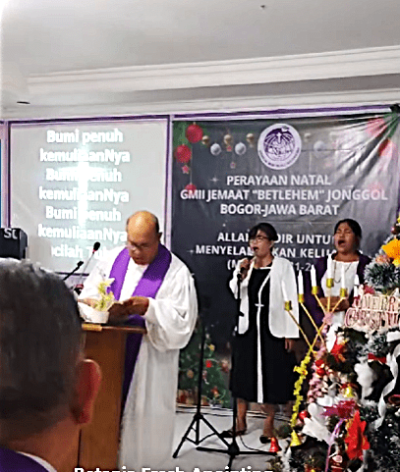 Pastor Irianto Budy leading GMII Bethlehem church service in Sukasirna village, Jonggol District, West Java Province, Indonesia. 