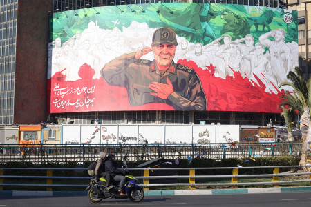 Iranians ride their motorbike past a huge banner of former Iranian Islamic Revolutionary Guard Corps (IRGC) Quds Force commander Qasem Soleimani ahead of the sixth anniversary of his assassination. Photo taken at Valiasr Square in Tehran, on Dec. 31, 2025. Soleimani was killed on Jan. 3, 2020, in a targeted U.S. airstrike at Baghdad airport in Iraq.