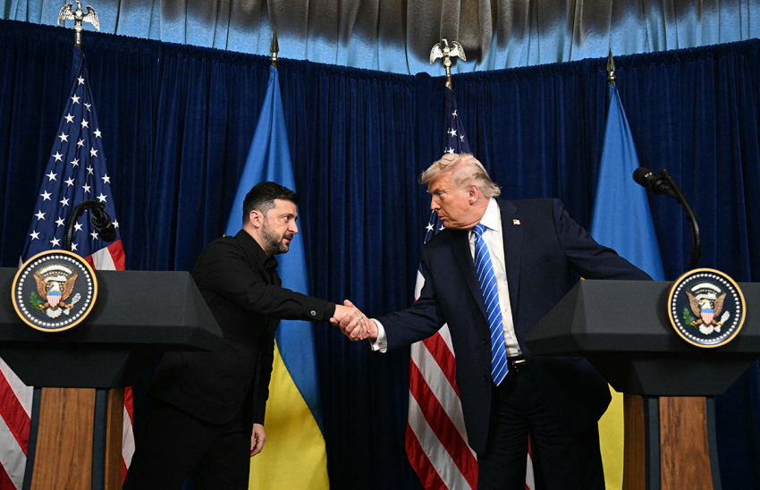 U.S. President Donald Trump and Ukranian President Volodymyr Zelensky shake hands during a press conference following talks at Trump's Mar-a-Lago residence in Palm Beach, Florida, on Dec. 28, 2025.