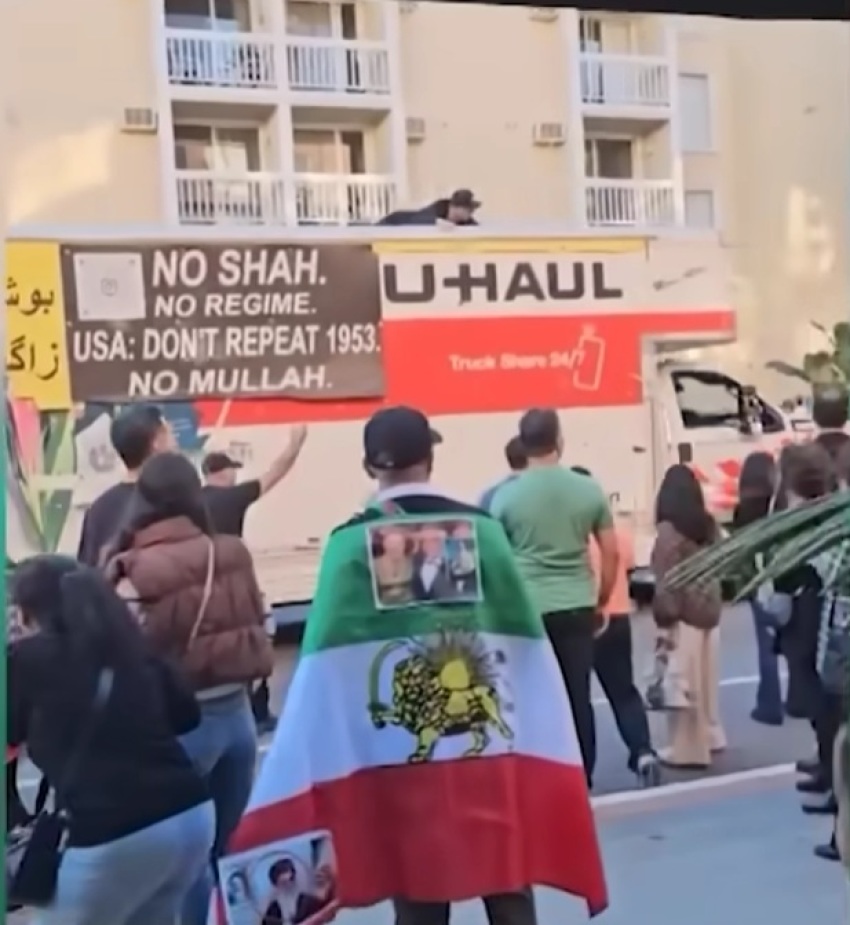 The driver of a U-Haul truck drives through a protest in California, held in support of demonstrators in Iran, on Sunday, Jan. 11, 2026. 