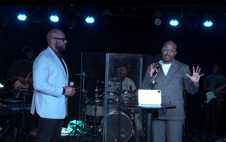 Jamaal Bernard (L), the new senior pastor of the multi-campus Christian Cultural Center, listens as Sam Collier (R) addresses the congregation in Atlanta, Georgia, on Jan. 4, 2026.