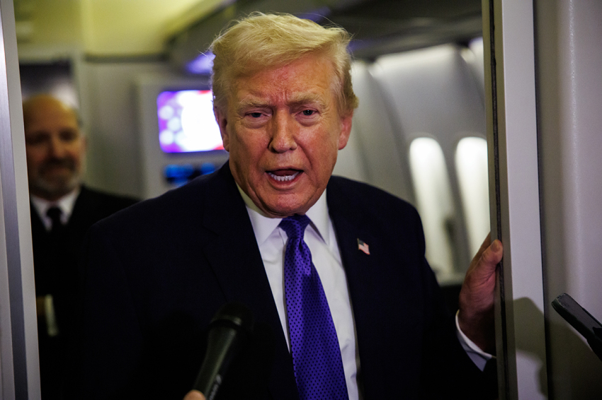 President Donald Trump gaggles with reporters while aboard Air Force One on Feb. 6, 2026, en route to Palm Beach, Florida. The President is spending the weekend at Mar-a-Lago, his private club. 