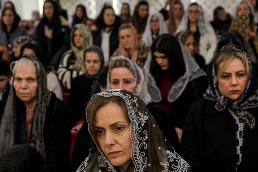 Worshippers attend the Christmas eve service at the Cathedral of the Holy Apostles, within the complex of the Assyrian Catholic Patriarchate of the East, in the capital of Iraq's northern autonomous Kurdish region Erbil on December 24, 2024.