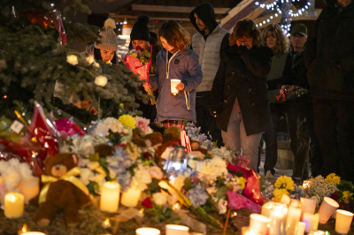 Community members mourn during a candlelight vigil for the victims of Tumbler Ridge Secondary School where a mass shooting took place a day earlier in the small town of Tumbler Ridge, British Columbia, on Feb. 11, 2026. Canadian police said Feb. 11 an 18-year-old male who identified as transgender carried out a mass shooting in a remote mining town, killing six people at a local school, after slaying his mother and stepbrother. Police commander Dwayne McDonald said authorities still don't know the motive in Tuesday's mass shooting in Tumbler Ridge, but the shooter, who took his own life, was known to have mental health issues.