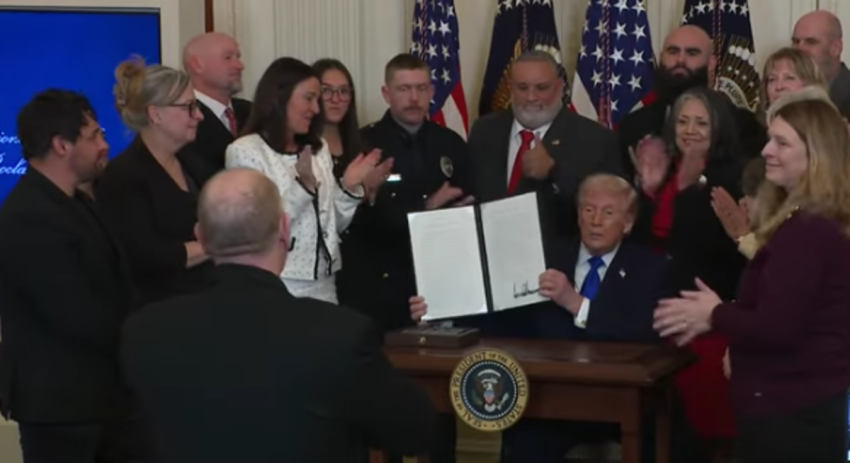 Members of angel families who lost their loved ones to crimes committed by illegal aliens look on as President Donald Trump signs a presidential proclamation recognizing Feb. 22 as National Angel Family Day in a White House ceremony, Feb. 23, 2026.