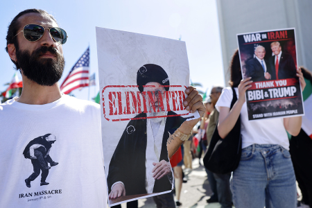 A man holds a picture of Iranian leader Ayatollah Ali Khamenei reading "ELIMINATED" as members of the Iranian community and supporters celebrate on Feb. 28, 2026, in Los Angeles, California. President Donald Trump announced that the United States and Israel had launched an attack on Iran Saturday morning. Israel and the United States have said Khamenei was killed in the strikes. 