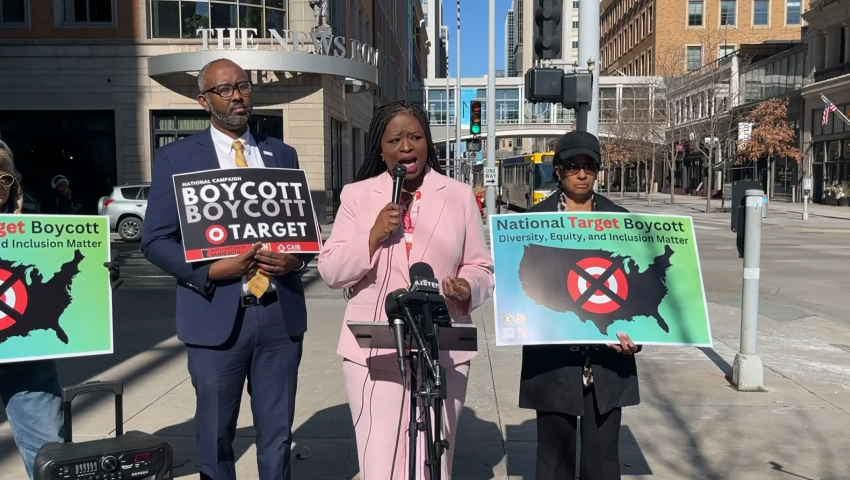 Nekima Levy-Armstrong (podium), an award-winning attorney and civil rights activist, who leads the Racial Justice Network said the Target boycott is not over.