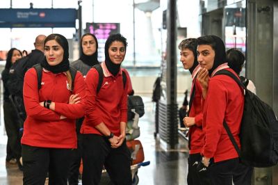 Members of Iran's women's football team arrive at the Kuala Lumpur International Airport in Sepang on March 16, 2026, after staying in a hotel in the Malaysian capital while awaiting the next leg of their journey home. Three more members of the Iranian women's football team have left their asylum in Australia and decided to return home, Canberra said on March 15.