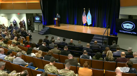 Attendees bow their heads in prayer during a prayer service at the Pentagon started by War Secretary Pete Hegseth.