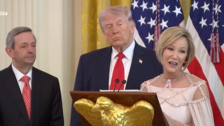 Televangelist Paula White-Cain, flanked by President Donald Trump and FBC Dallas senior pastor Robert Jeffress, delivers remarks during a private Easter lunch at the White House on April 1, 2026.