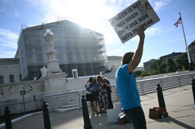 Members of the group "Concerned Women for America" pray outside the US Supreme Court as the Court hears oral arguements in Chiles v. Salazar, a landmark case on "conversion therapy," on October 7, 2025, in Washington, DC. The Supreme Court will hear a challenge today by a Christian therapist to a Colorado law that bans "conversion therapy" for minors who are questioning their gender identity or sexual orientation. The case was brought by Kaley Chiles, a licensed mental health counselor who argues that the prohibition from holding such conversations with minors is a violation of her First Amendment free speech rights.