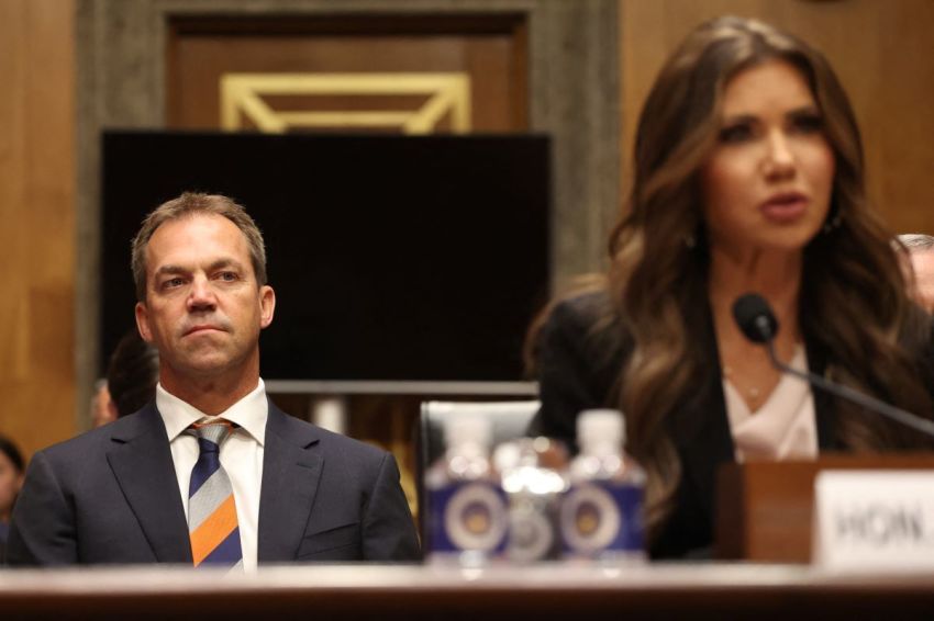 Bryon Noem (L), husband of former U.S. Secretary of Homeland Security Kristi Noem (R), listens as his wife testifies before the Senate Committee on Homeland Security and Governmental Affairs on Capitol Hill in Washington, D.C., May 20, 2025. 