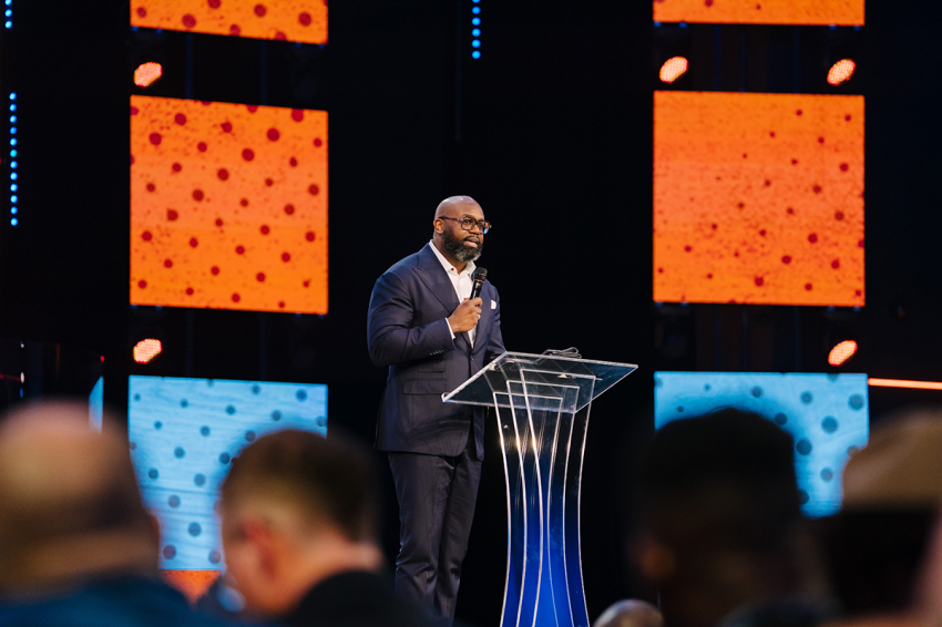 Pastor John K. Amanchukwu Sr. speaking at the TPUSA Faith Forward Pastors' Summit in Grapevine, Texas, on April 22, 2026.