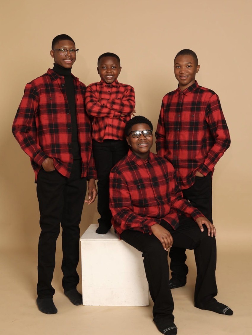 Luke Tillman (2nd L) and his three older brothers.