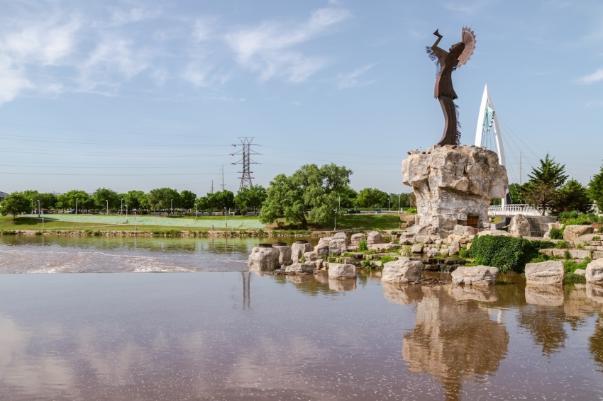 Keeper of the Plains, an iconic sculpture by Indian artist Blackbear Bosin, stands at the confluence of the Arkansas and Little Arkansas rivers in Wichita, Kansas.