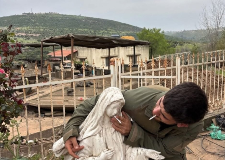 An IDF soldier photographed placing a cigarette into the mouth of a statue of the Virgin Mary, in a Christian village in southern Lebanon.