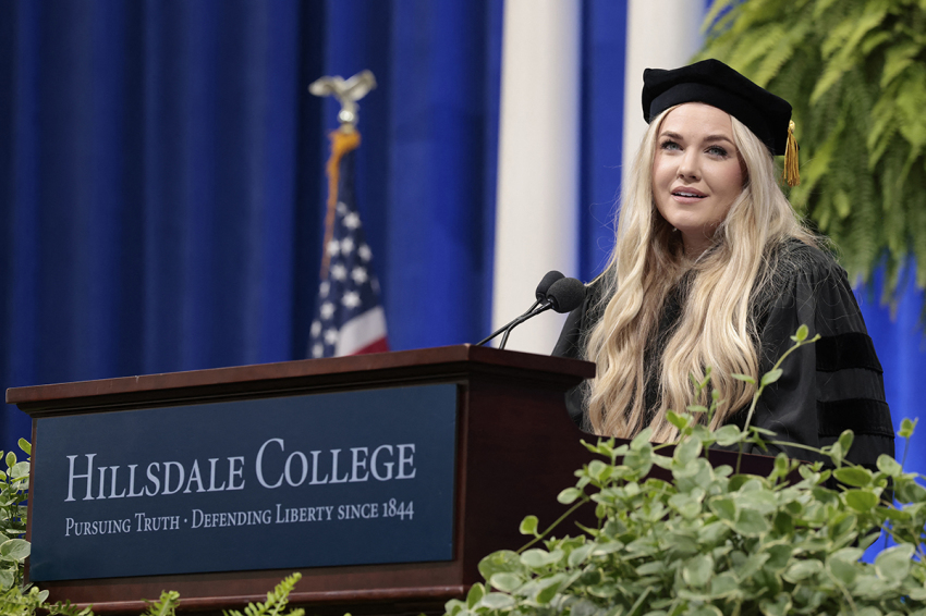 Erika Kirk, Turning Point CEO and widow of its founder Charlie Kirk, delivers a commencement address at Hillsdale College during the college's 174th commencement ceremony in Hillsdale, Michigan, on May 9, 2026. 