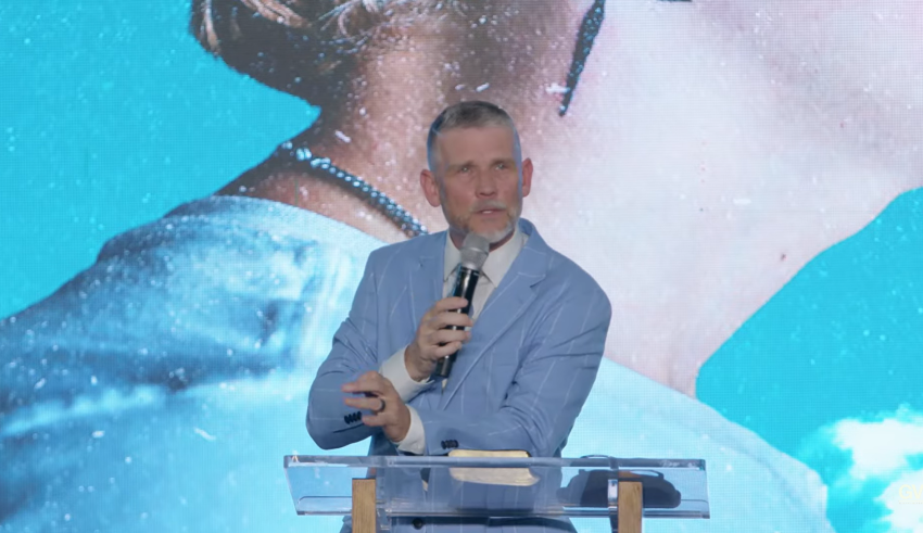 Pastor Greg Locke of Global Vision Bible Church in Lebanon, Tenn., speaks at a public memorial for his late son, Evan Locke, 20, on Wednesday, May 13, 2026.