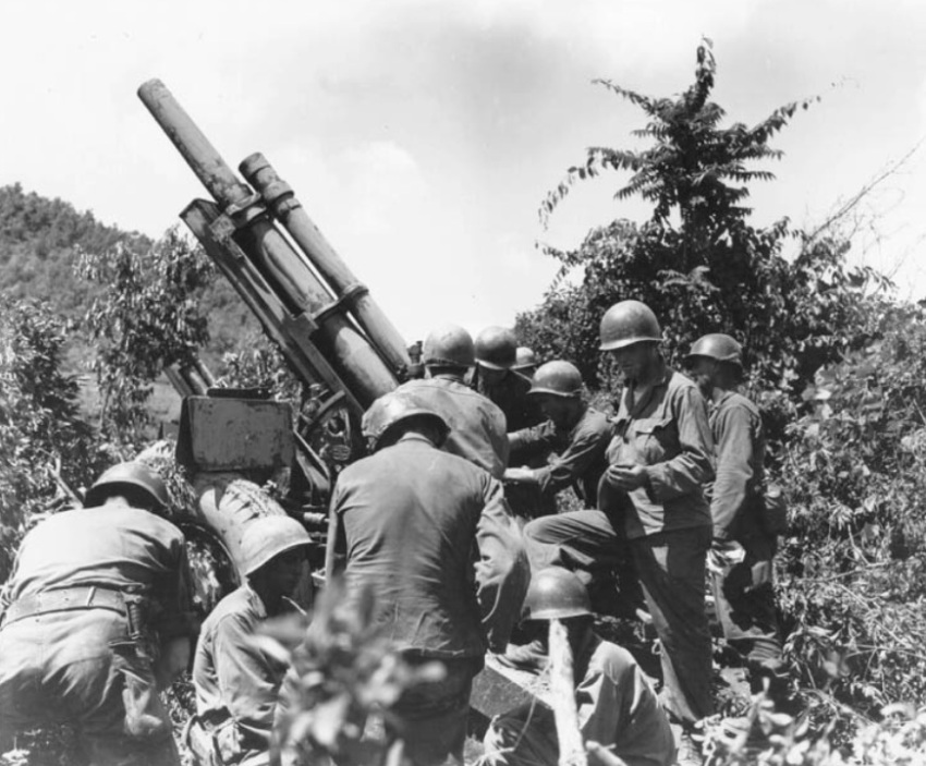 American soldiers operate a howitzer during the Korean War.