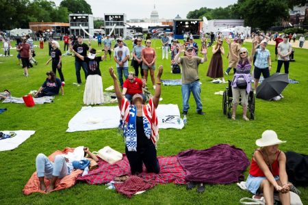 Attendees worship during Rededicate 250: A National Jubilee of Prayer, Praise and Thanksgiving, on the National Mall, on May 17, 2026, in Washington, D.C.