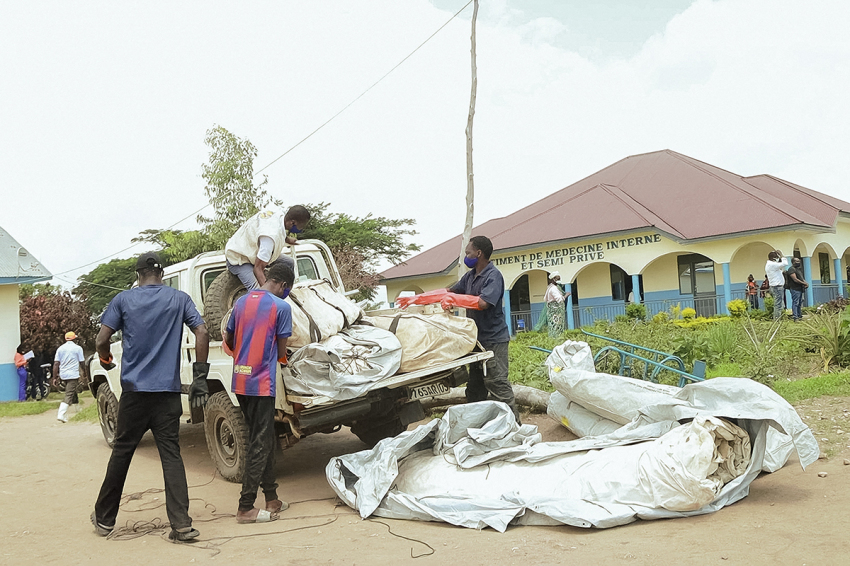 Staff members unload structures used in the process of the treatment of Ebola at a hospital in Rwampara on May 19, 2026. The World Health Organization on May 19, 2026, voiced concern about the "scale and speed" of an Ebola outbreak that has killed more than 130 people in the Democratic Republic of Congo, warning it could be lengthy. At the hospital in Rwampara in northeastern Ituri province, the epicenter of the outbreak, near the border with Uganda and South Sudan, the response was slow, despite the surge in cases.