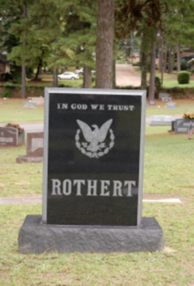 "In God We Trust" adorns the headstone of Matthew Rothert Sr., who died in 1989 at 85, at Memorial Park Cemetery in Camden, Arkansas.